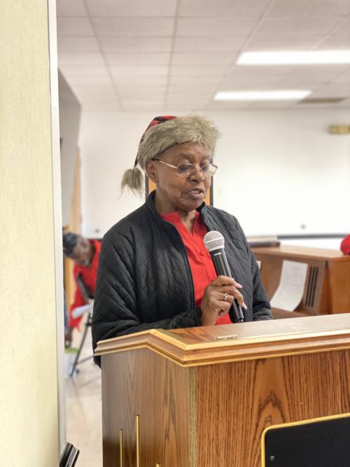 Garner Friendship Cafe attendee Ivenea read a stirring rendition of "The House by the Side of the Road" by Sam Walter Foss at the Cafe's Holiday Party.