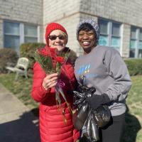 Volunteers are all smiles as they get ready to deliver donated bouqets from Mission Flowers.